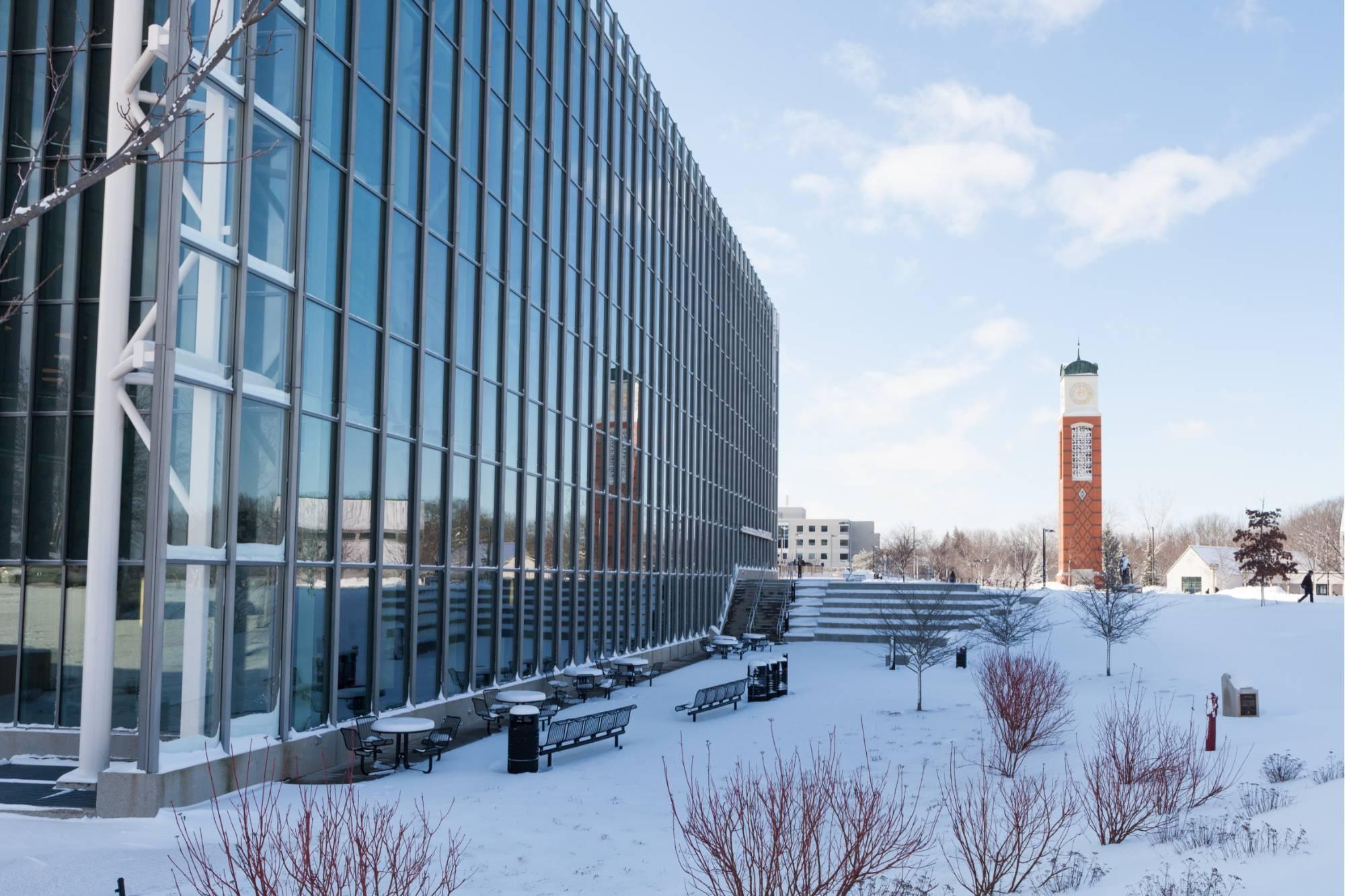 Cook Carillon Tower and Mary Idema Pew Library photographed in the winter with snow in the foreground